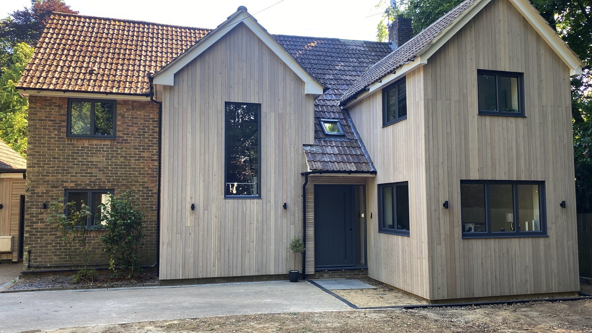 sheer line-classic aluminium windows in a timber-clad house