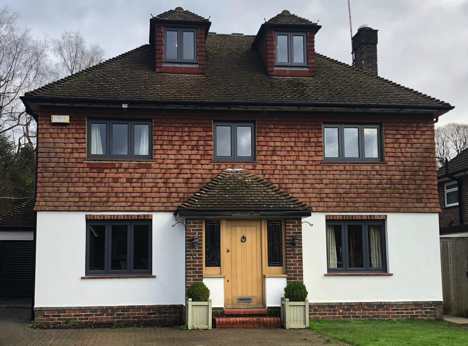 aluminium windows in a detached mock-tudor house