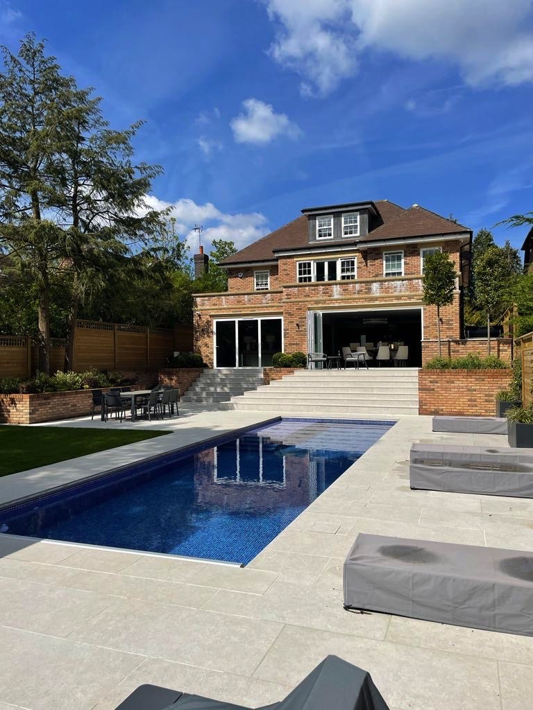 large surrey house with pool fitted with sliding sash windows