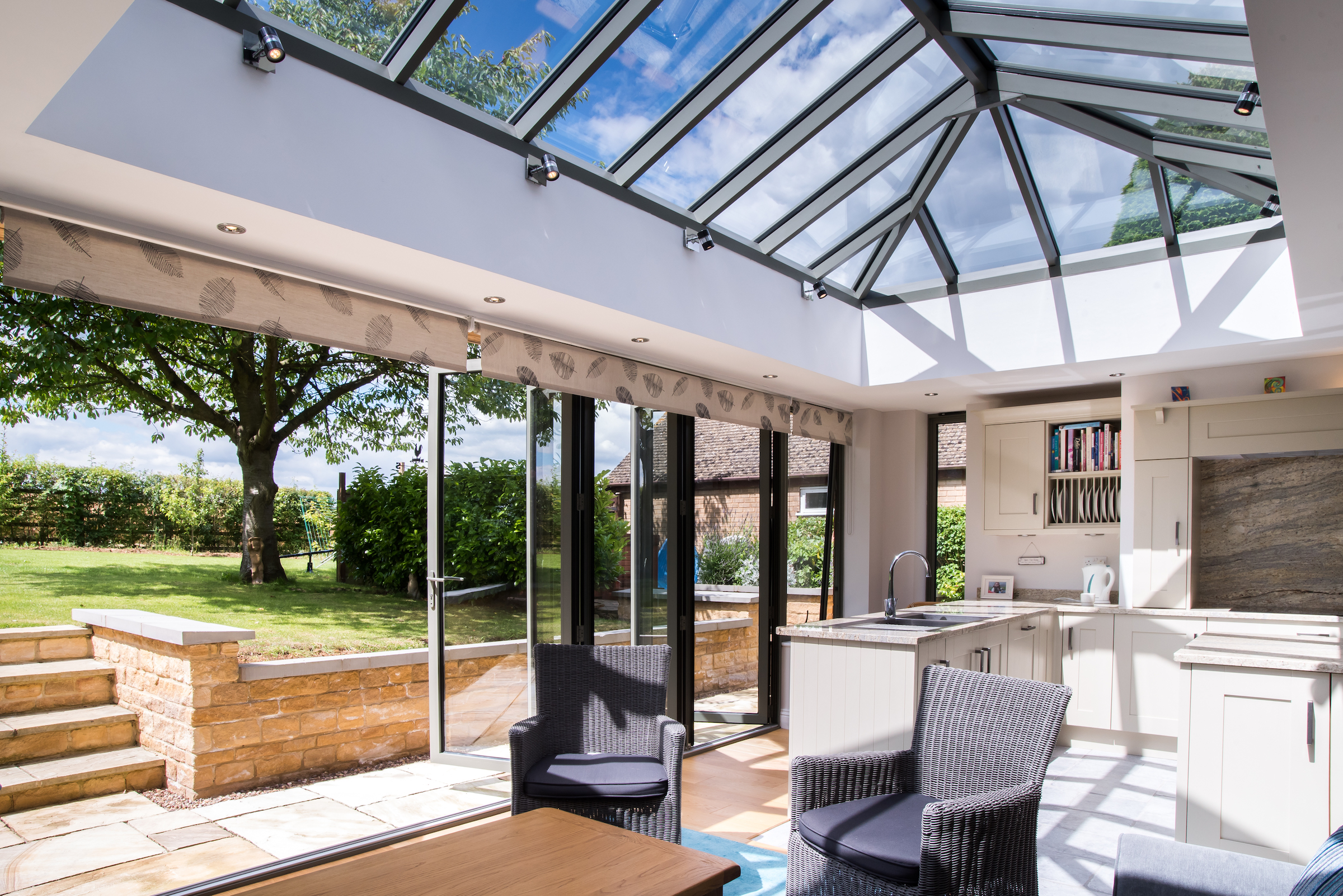 sheerline lantern roof with bifold doors in modern orangery extension