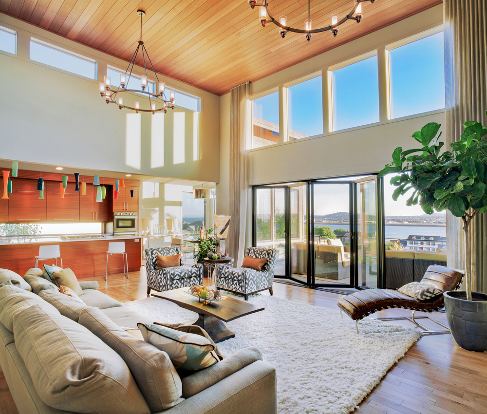 sheerline bifold doors in a double storey lounge with river views