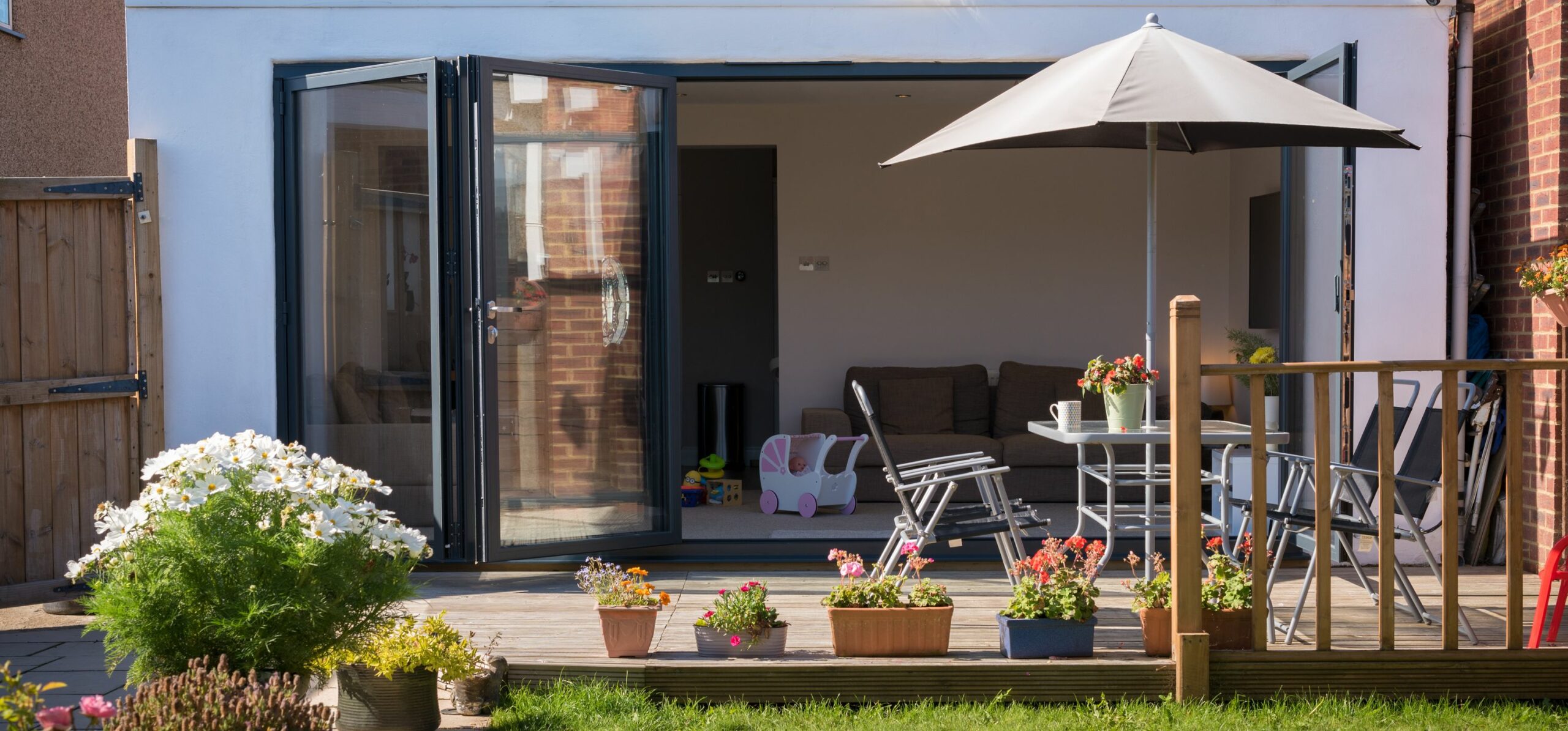 open origin ob-72 bifold door external view with open parasol