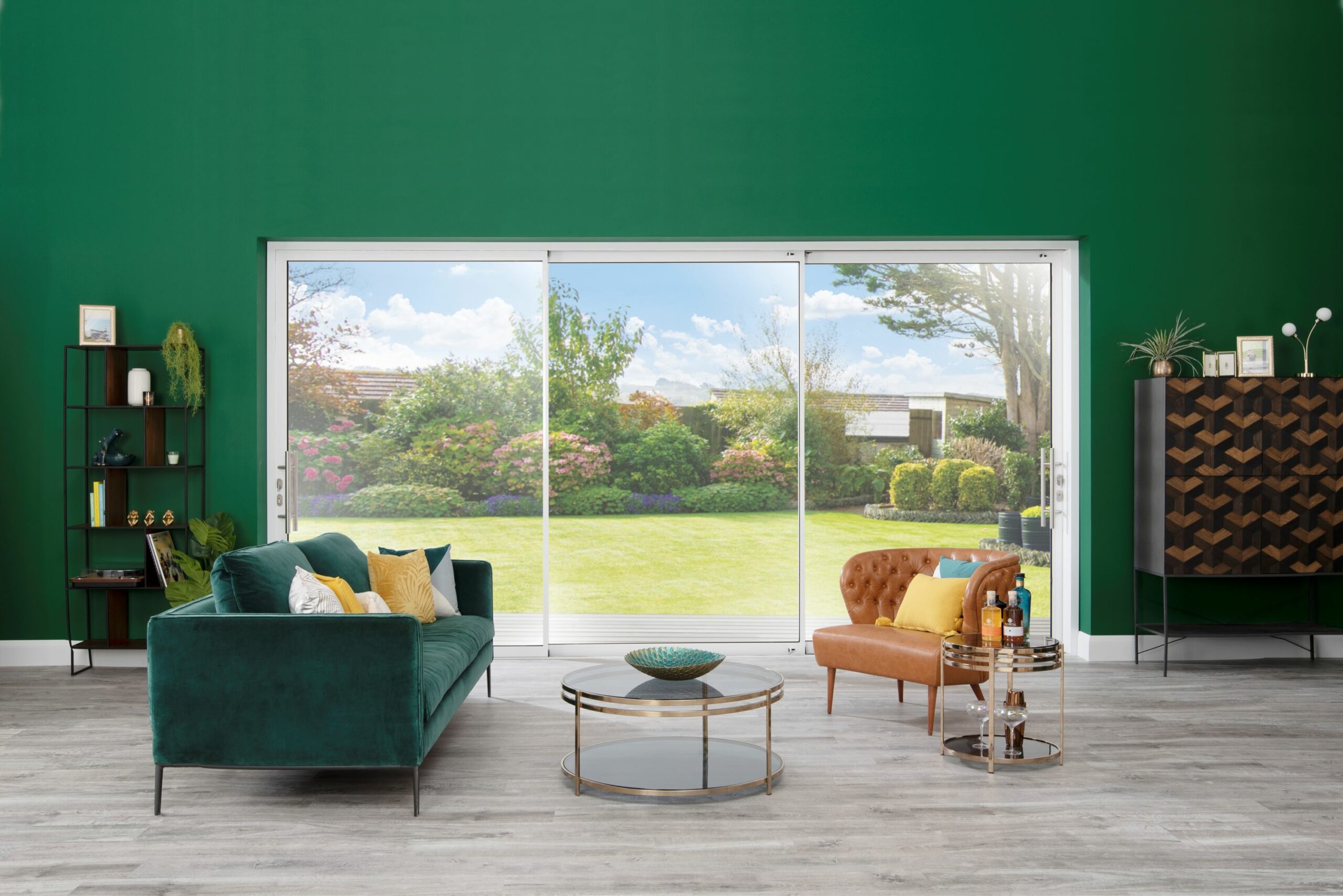 white cortizo sliding doors in a green-wall backdrop setting