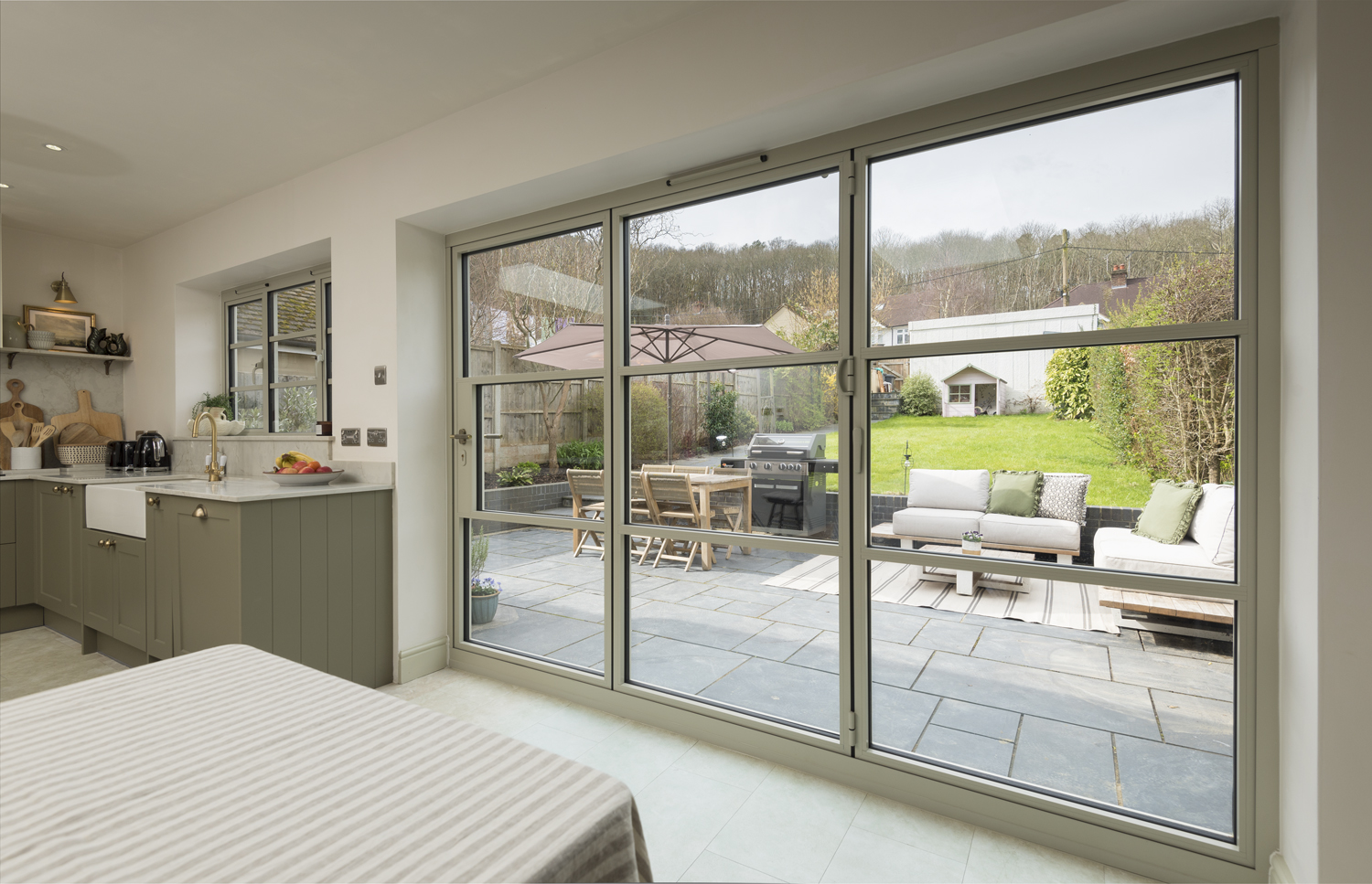 origin-ob-36 bifold door with matching window in a kitchen extension