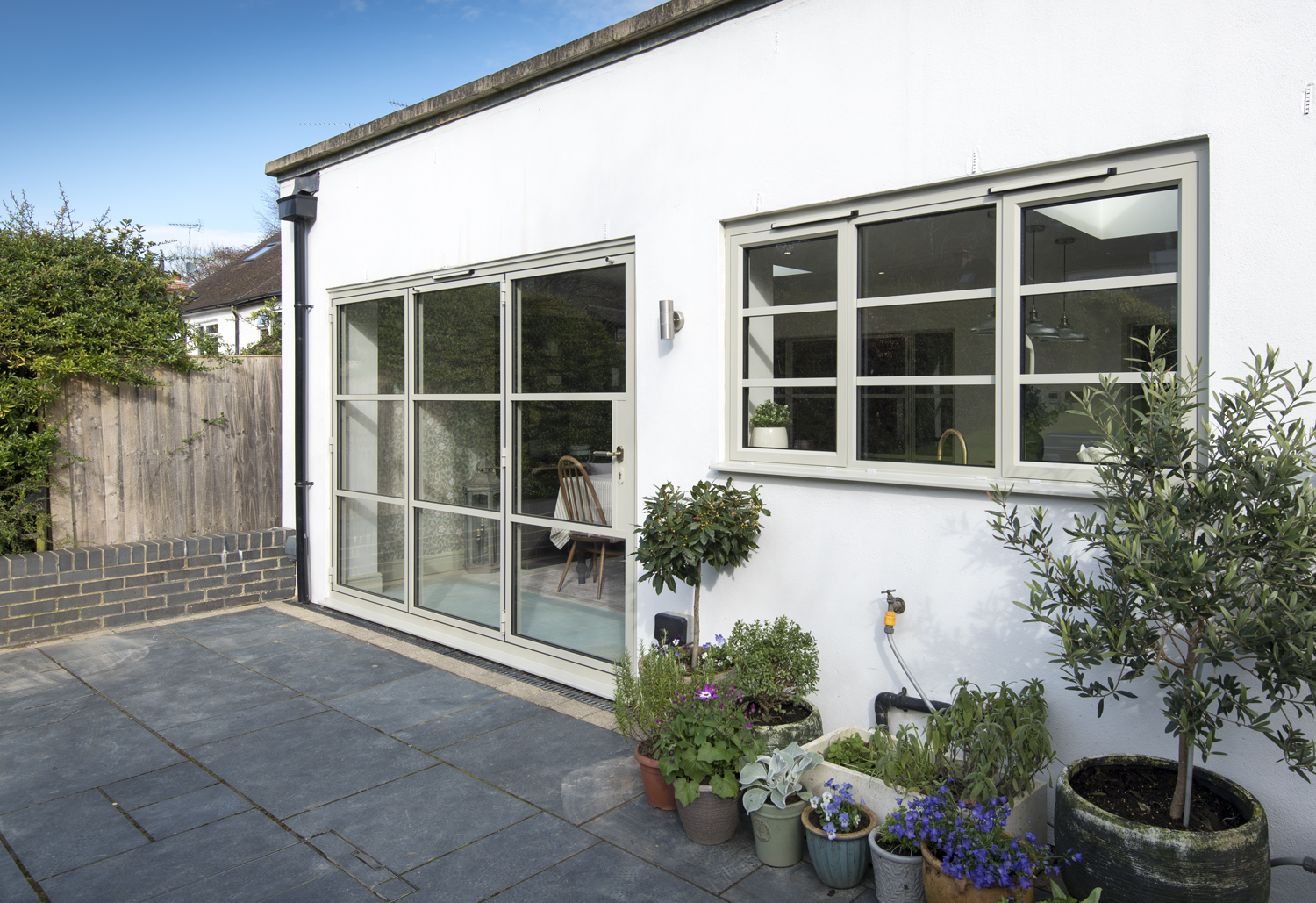 origin-ob-36 bifold door with matching window in a kitchen extension